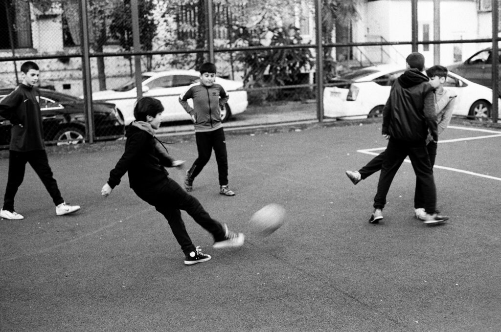 A group of boys playing a game of soccer